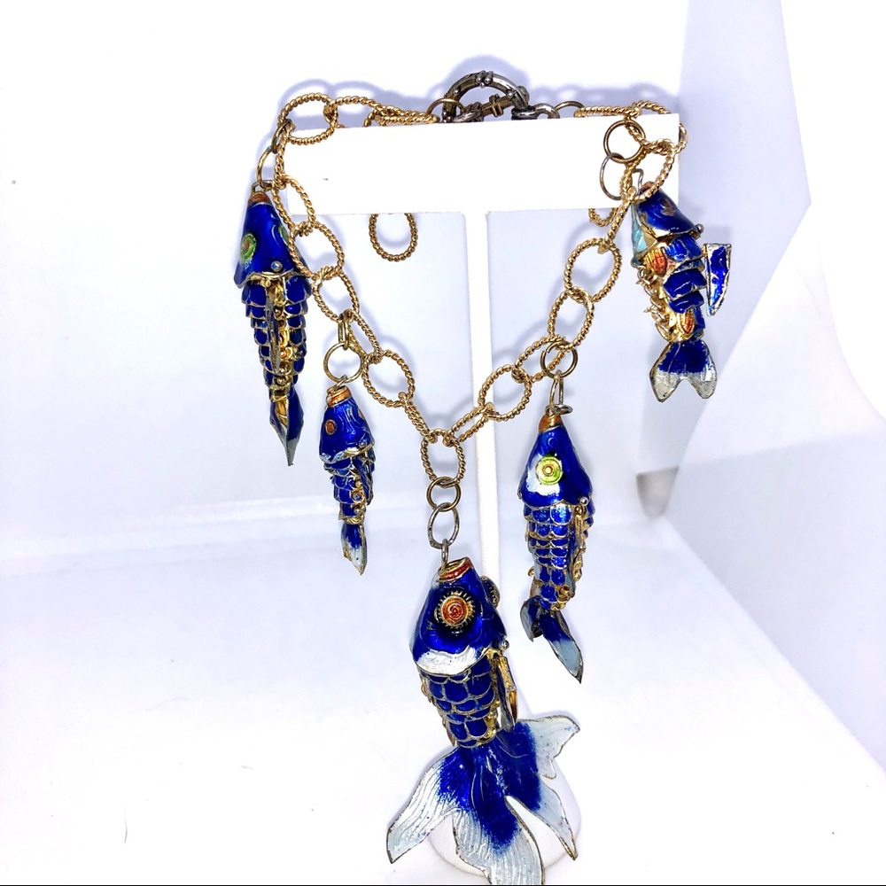Gold colored link bracelet with 5 blue cloisonne articulated koi.
